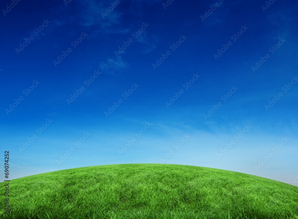 Fototapeta premium Green hill under blue sky