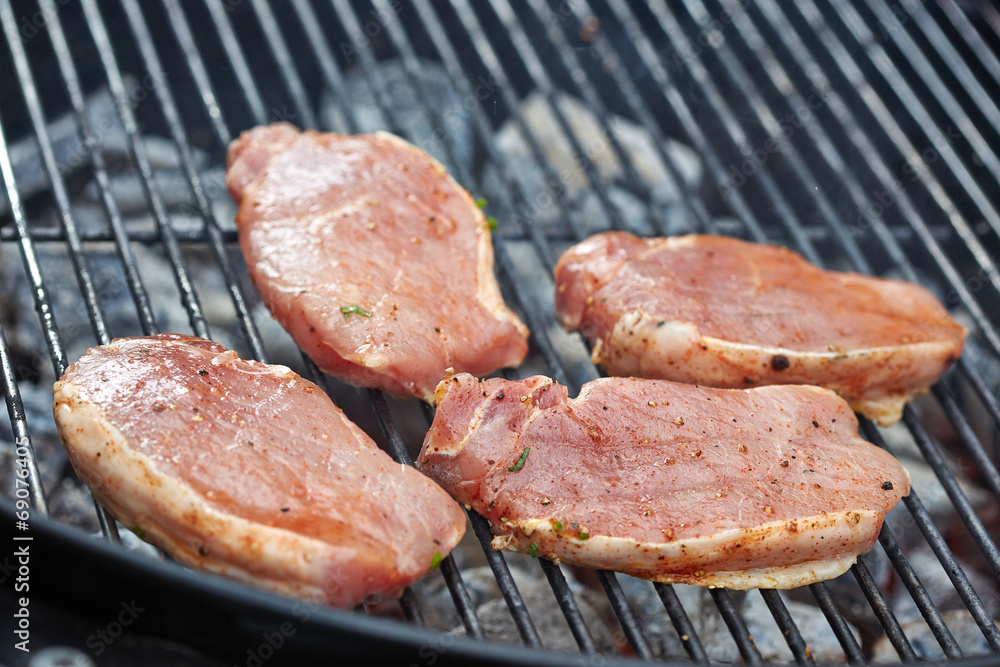 raw meat on grill raw meat on grill