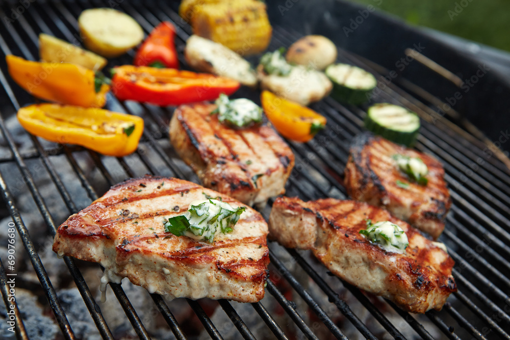 prepared meat and vegetables on grill