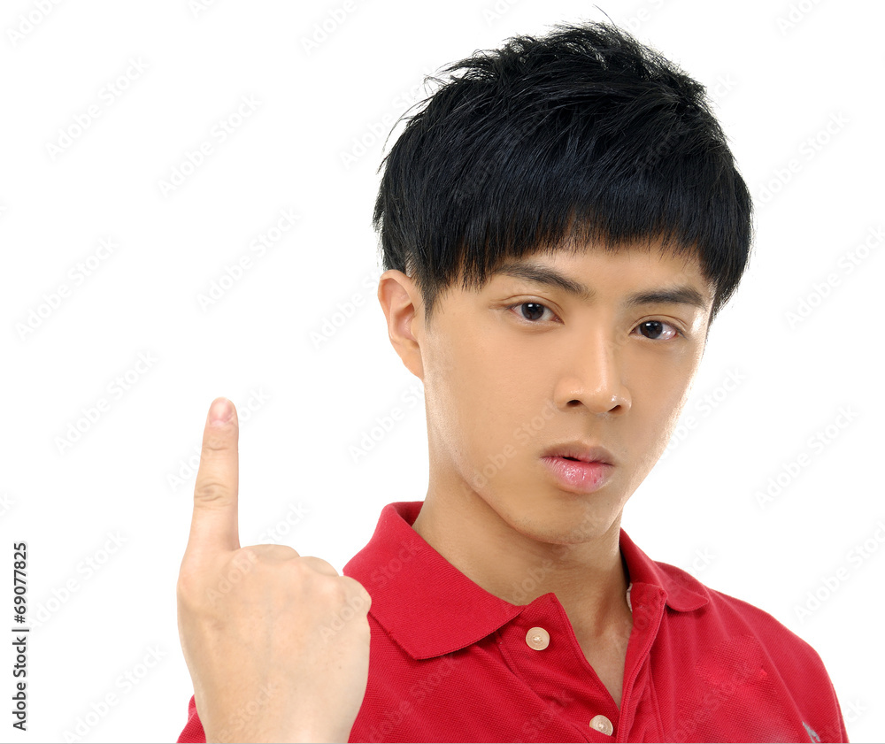 Close up Portrait of young asian man pointing up Close up Portrait of young asian man pointing up
