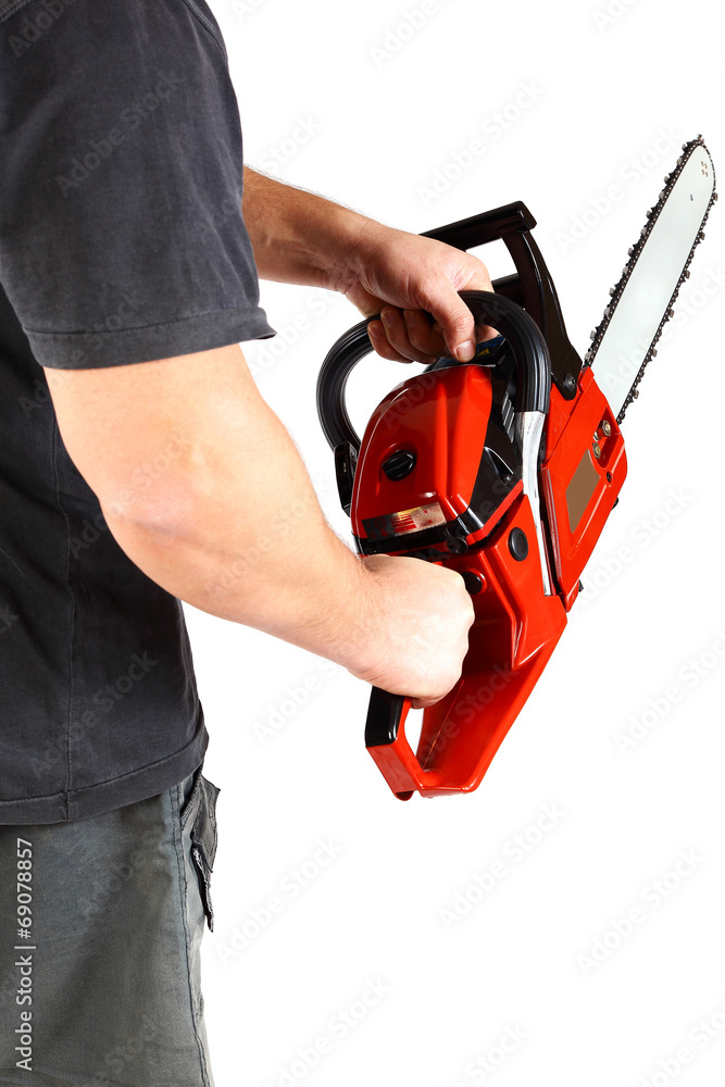 Man with gasoline chain saw in hand.