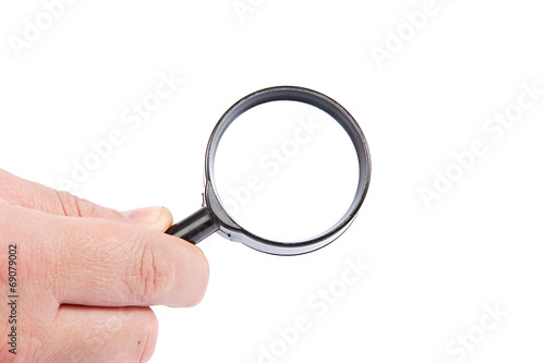 Magnifying glass in hand isolated on white background.