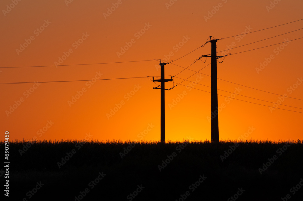 sunset and electric pylons