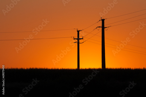 sunset and electric pylons