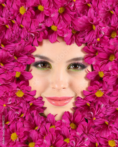 Woman beauty face with beautiful flowers frame, close-up © Africa Studio