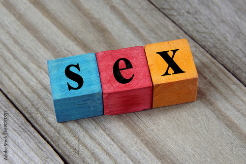 sex word on wooden colorful cubes