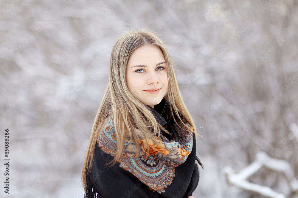 Beautiful Russian woman in a scarf in winter Beautiful Russian woman in a scarf in winter