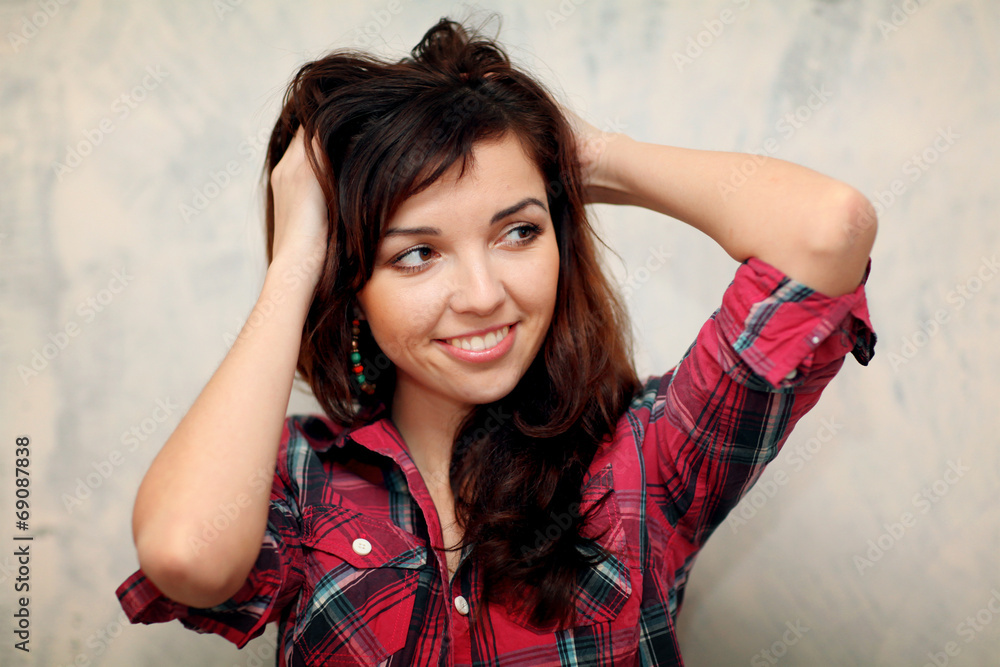 Portrait of a brunette in denim style studio Portrait of a brunette in denim style studio