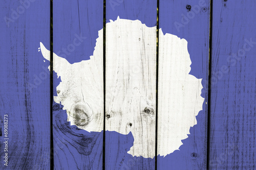 Antarctica flag on wooden background photo