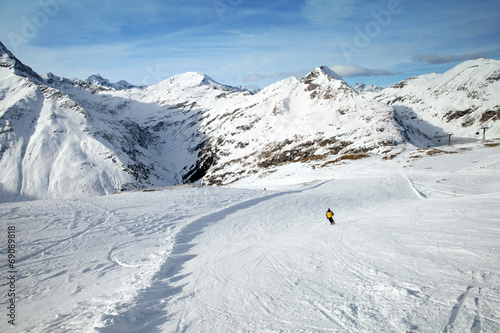 The man skiing on snowy slope in Alps, Sportgastein