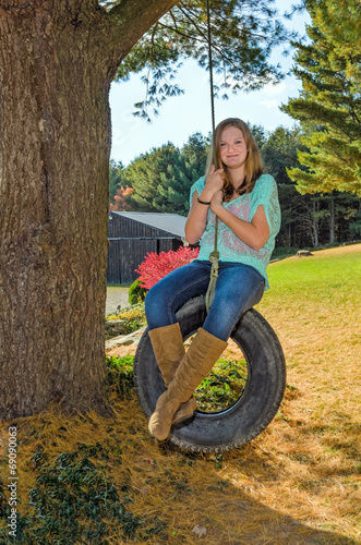 Pretty Girl on Tire Swing photo
