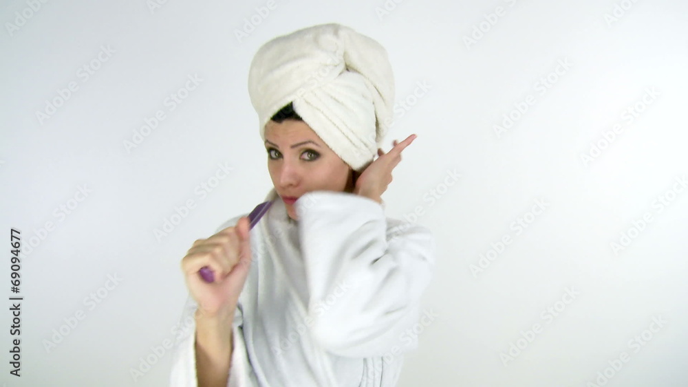 Woman singing and dancing in bathrobe isolated Woman singing and dancing in bathrobe isolated