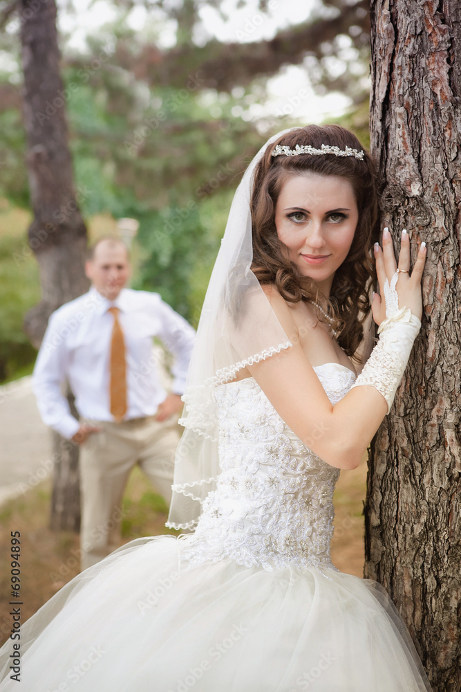 Newly married couple posing in autumn park Newly married couple posing in autumn park