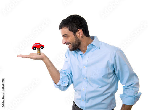 young happy attractive man thinking of buying a new car