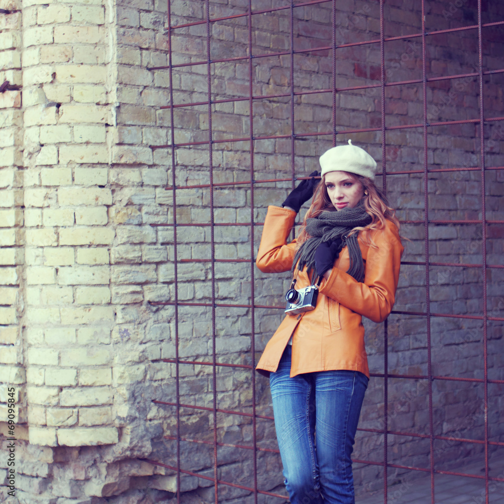 girl with an old camera walks through the streets girl with an old camera walks through the streets
