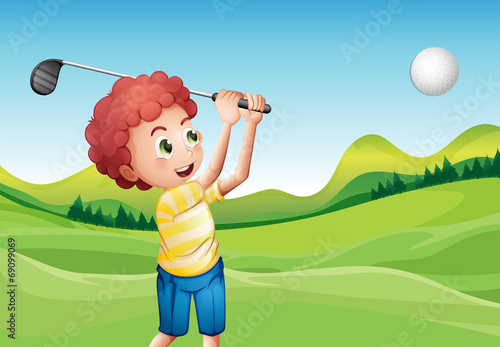 Boy playing golf