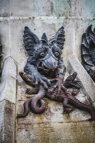 devil figure, bronze sculpture with demonic gargoyles and monste photo