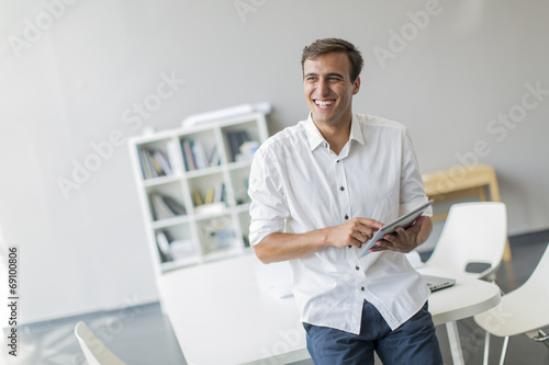 Young man with tablet in th...