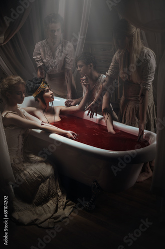Woman having a blood bath photo