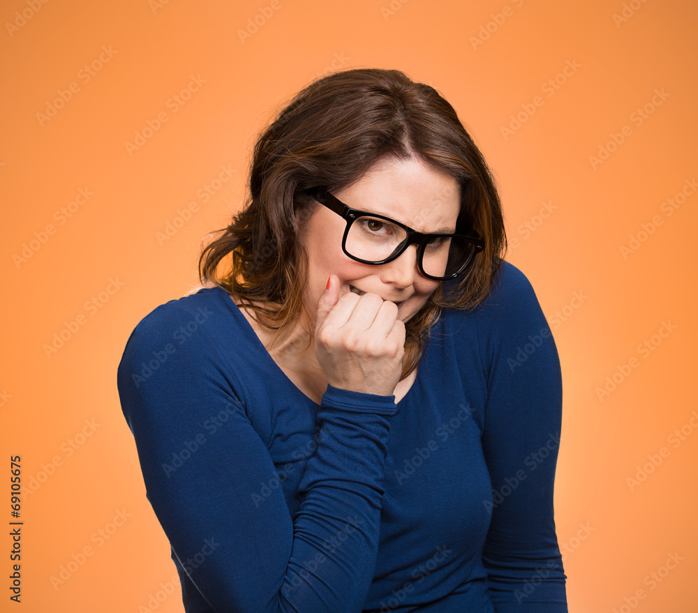 Anxious insecure woman, isolated on green background Anxious insecure woman, isolated on green background