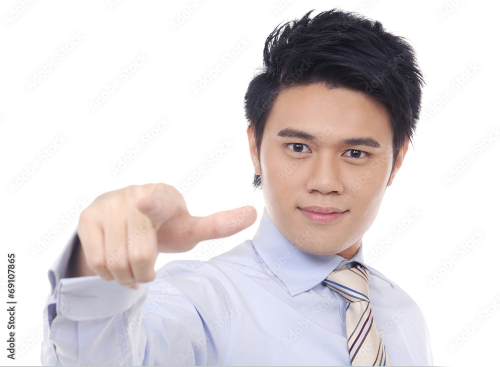 Business young man touching an imaginary screen or button Business young man touching an imaginary screen or button