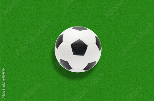Soccer ball in green grass background