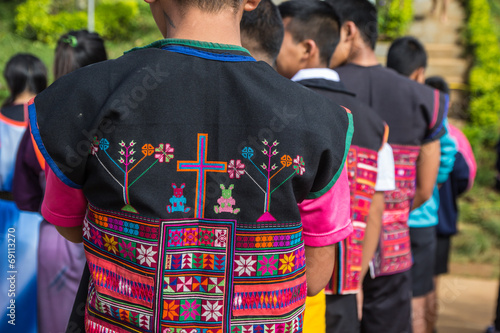 Cross sign on vest of akha tribe in thailand