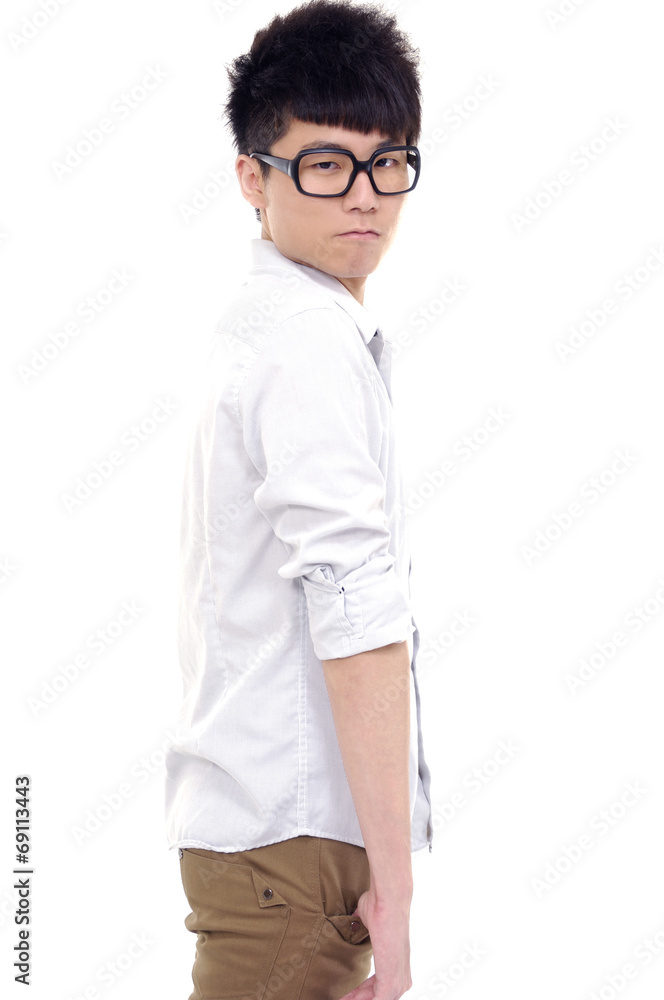 young man in sunglasses standing with hands in pockets young man in sunglasses standing with hands in pockets