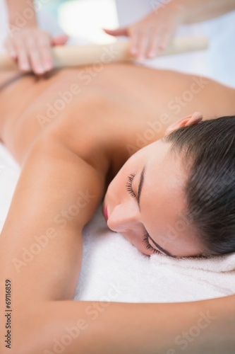 Attractive woman receiving treatment at spa center