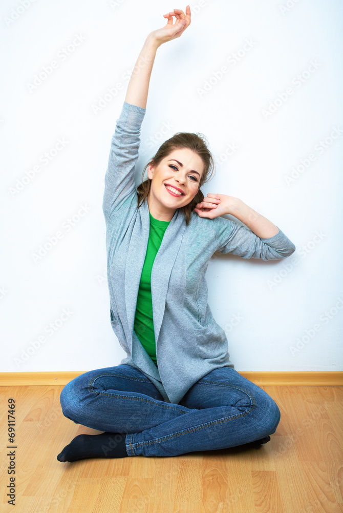 Woman natural portrait seatting on a floor. White background is Woman natural portrait seatting on a floor. White background is