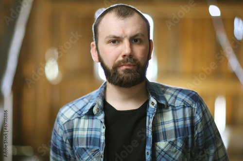 portrait of a bearded man in a rustic style