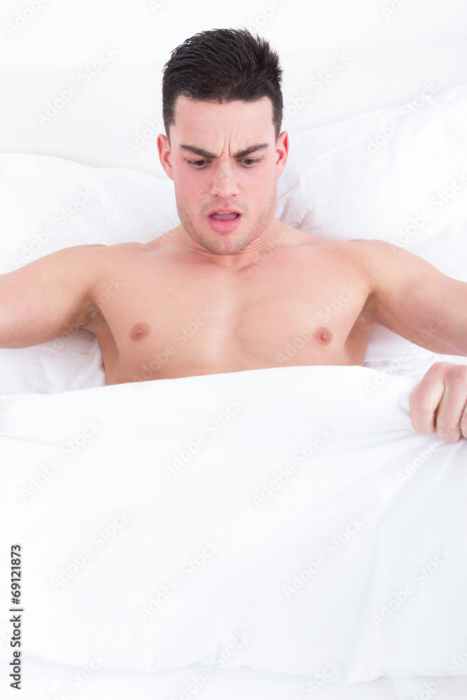 man looking down at his underwear at his penis man looking down at his underwear at his penis