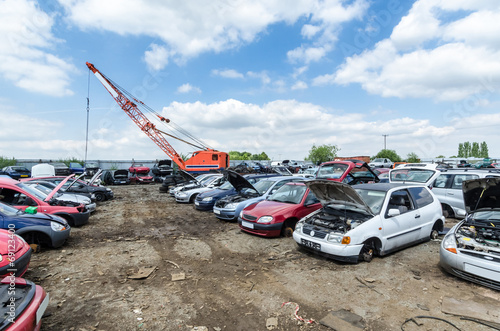 Photos Crane at a car scrapyard moving metal