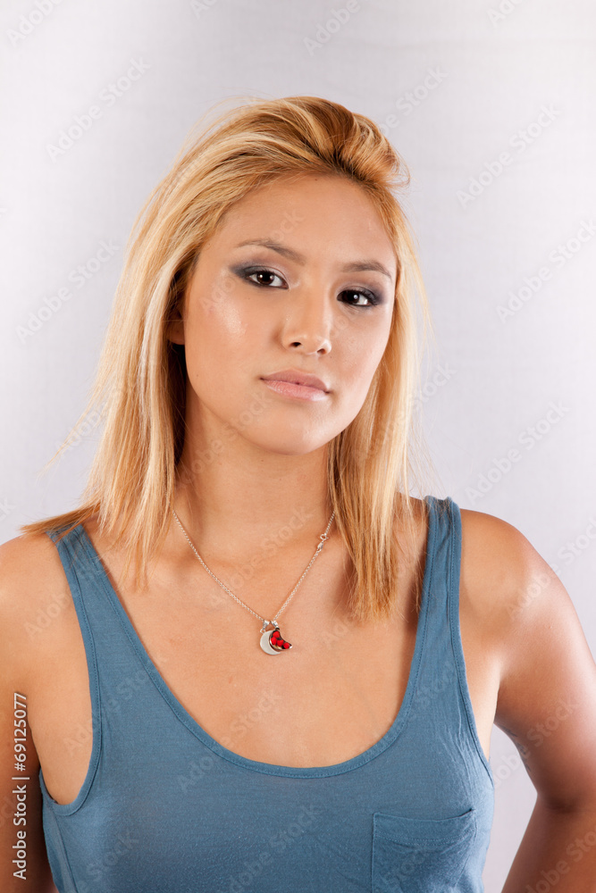 Blond woman looking seriously at the camera Blond woman looking seriously at the camera