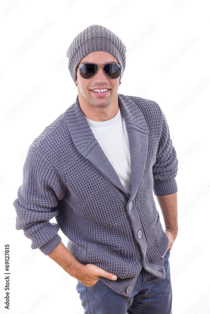 sexy fashion model in sweater wearing winter cap and sunglasses sexy fashion model in sweater wearing winter cap and sunglasses