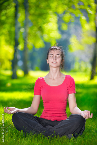 Young woman doing yoga exercises