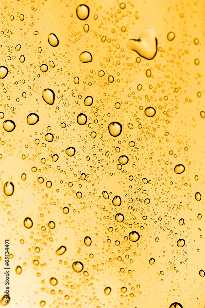 water drops on glass with gold water drops on glass with gold