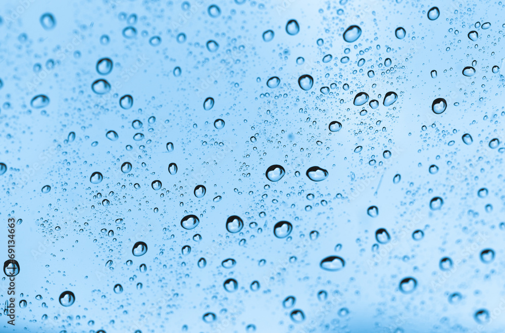 water drops on blue glass water drops on blue glass
