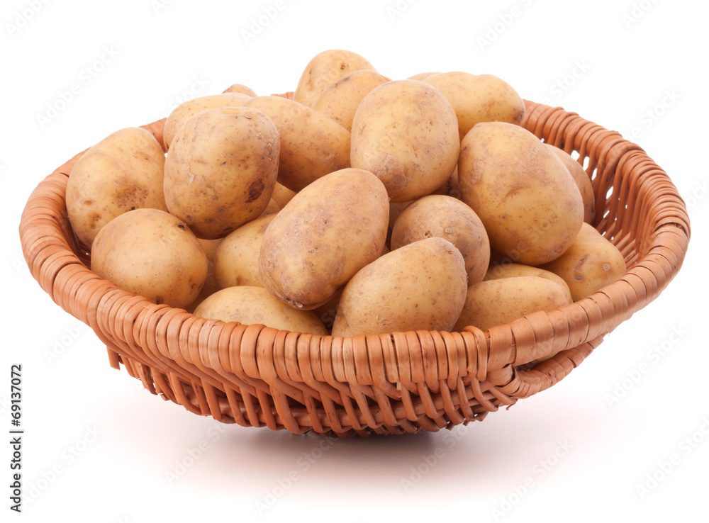 Potato tuber in wicker basket isolated on white background Potato tuber in wicker basket isolated on white background