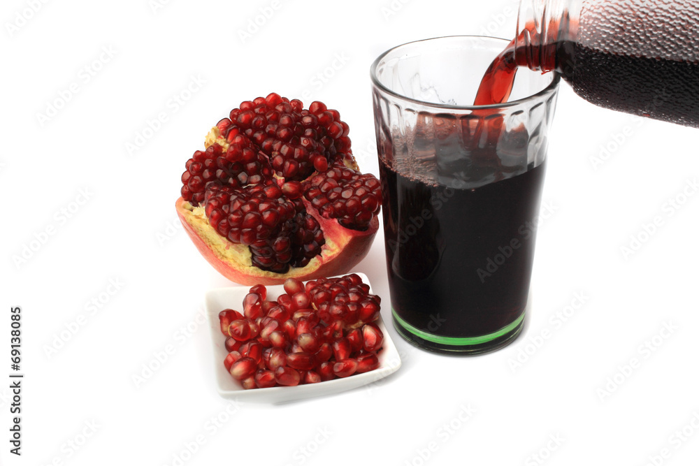 fresh pomegranate juice on a white background fresh pomegranate juice on a white background