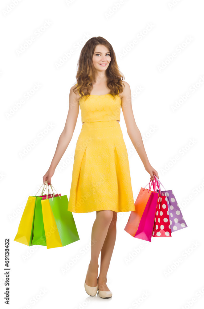 Woman after shopping spree on white