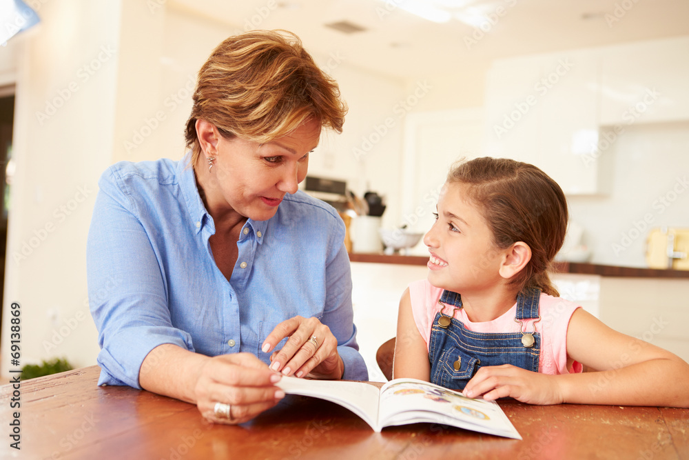Grandmother Reading With Granddaughter At Home Grandmother Reading With Granddaughter At Home