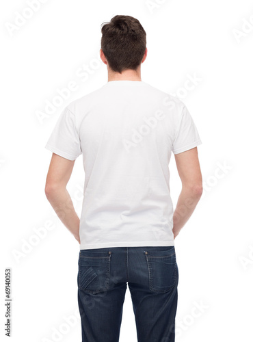 young man in blank white t-shirt from back