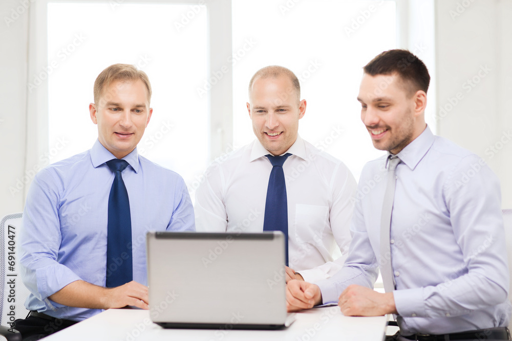 business team working with laptop in office business team working with laptop in office