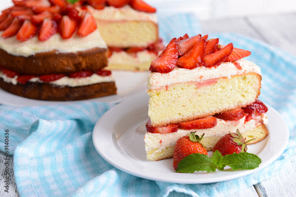 Delicious biscuit cake with strawberries on table close-up Delicious biscuit cake with strawberries on table close-up