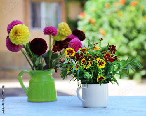 Wallpaper Mural Dahlia flowers in vase on table, outdoors Torontodigital.ca