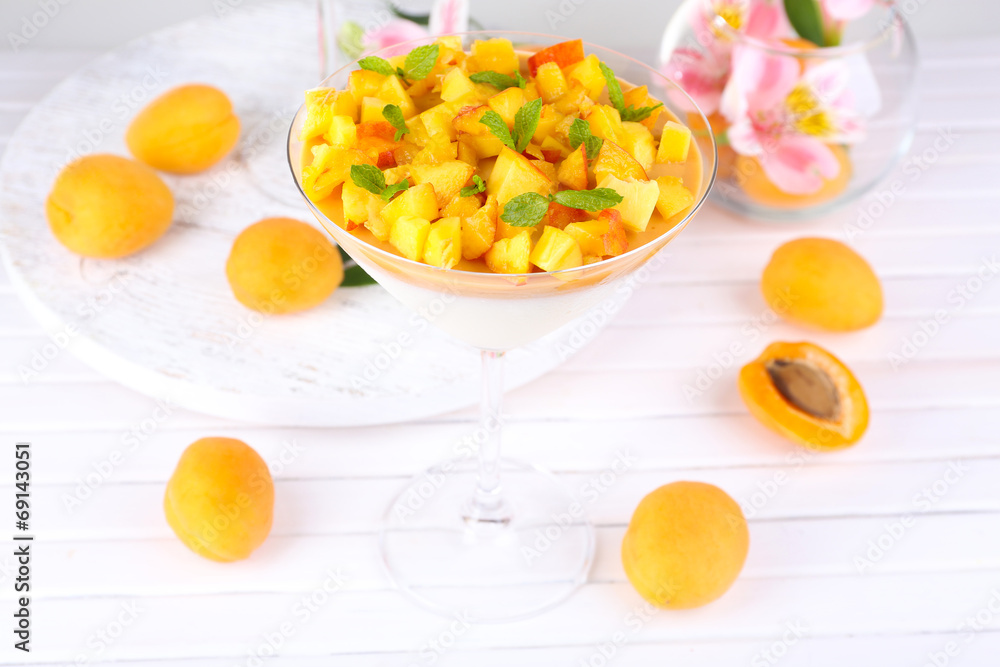 Apricot dessert in glass on table close-up Apricot dessert in glass on table close-up