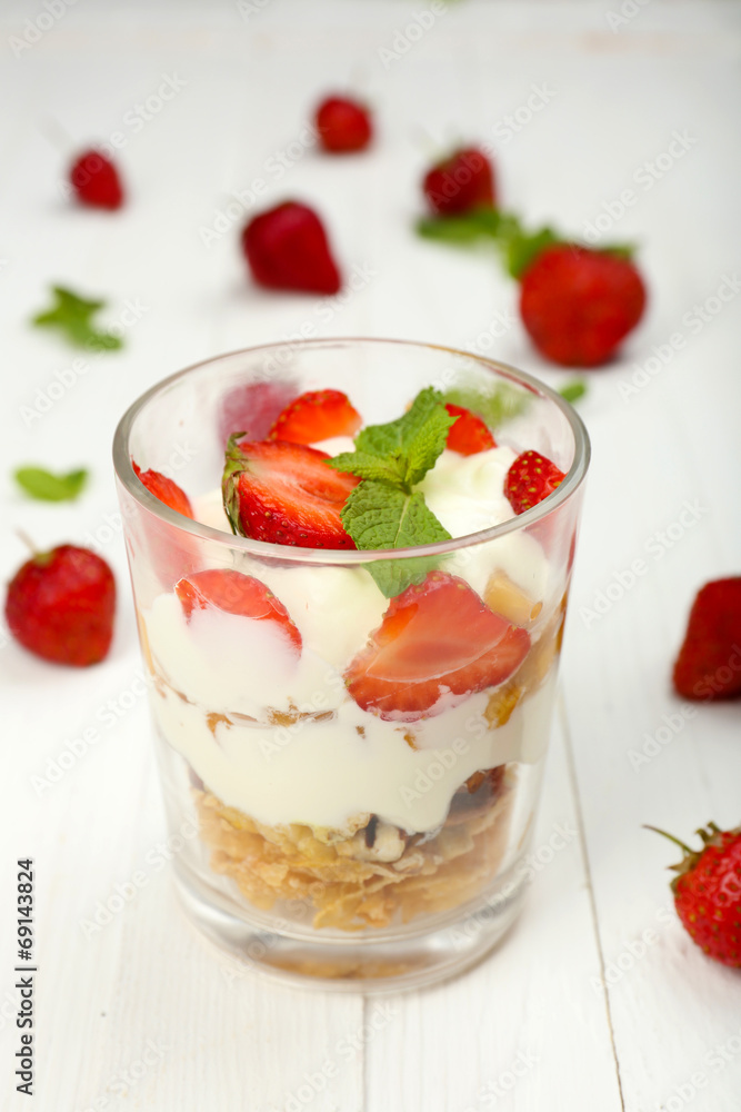 Natural yogurt with fresh berries on wooden table Natural yogurt with fresh berries on wooden table