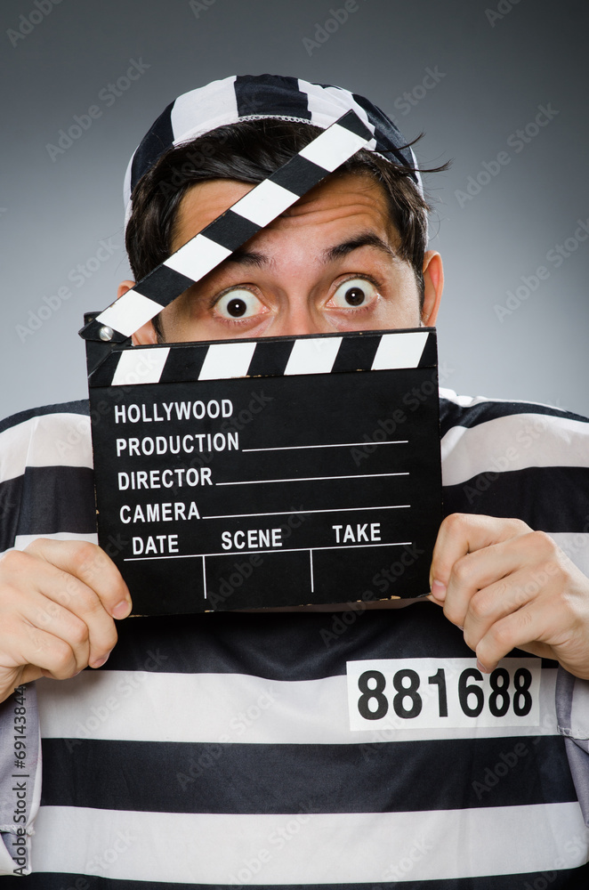 Inmate with movie clapper board Inmate with movie clapper board