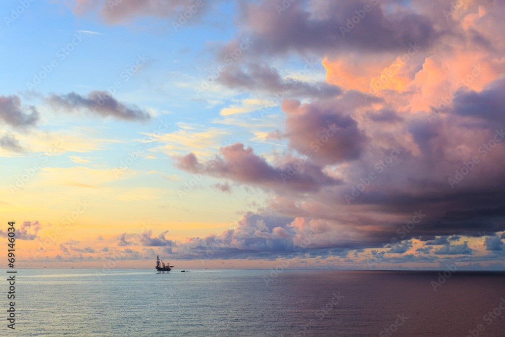 Offshore jack up drilling rig in the middle of the ocean during